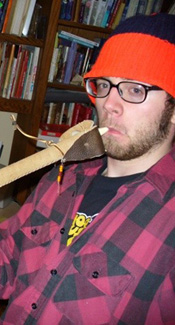 Deadgrass pretending to smoke his peace pipe/tomahawk